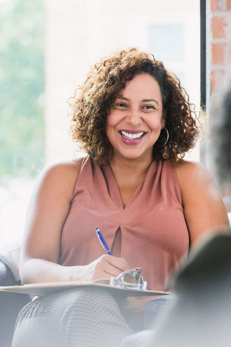 Mindful Healing Tall African American Female Therapist Talking with Patient