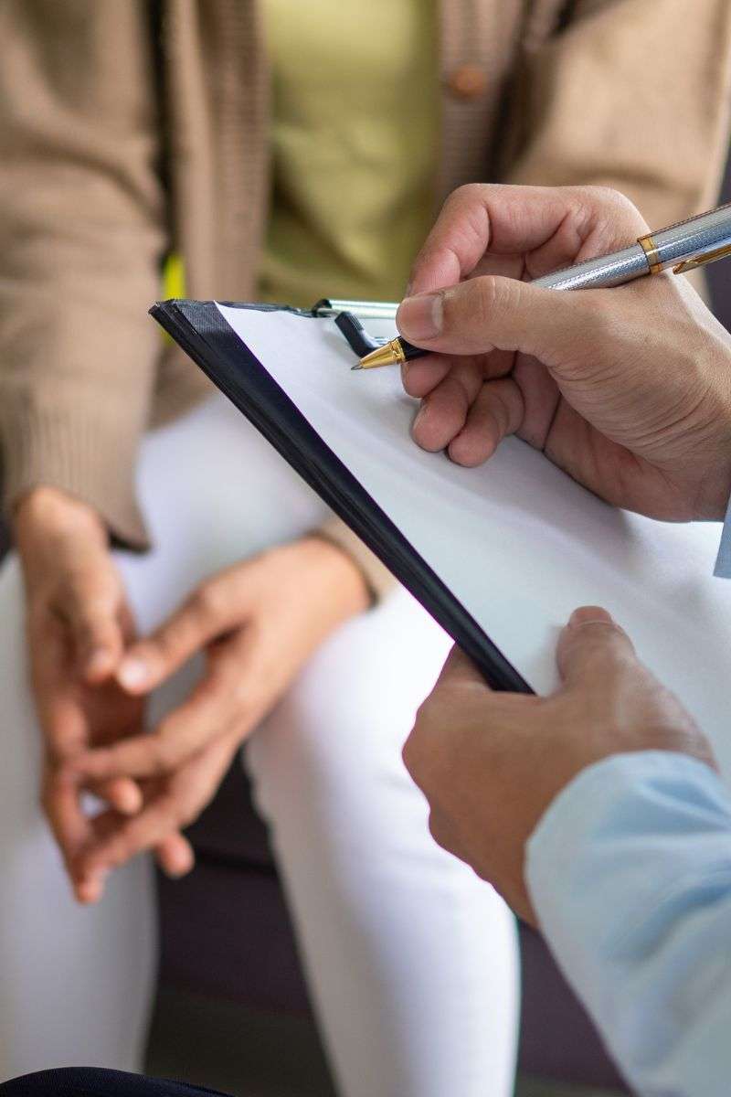 Mindful Healing Tall Therapist Taking Notes wth Patient