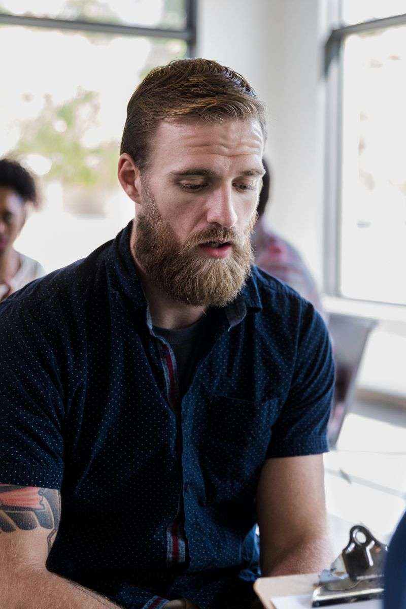 Mindful Healing Tall Therapist Talking with Male Patient