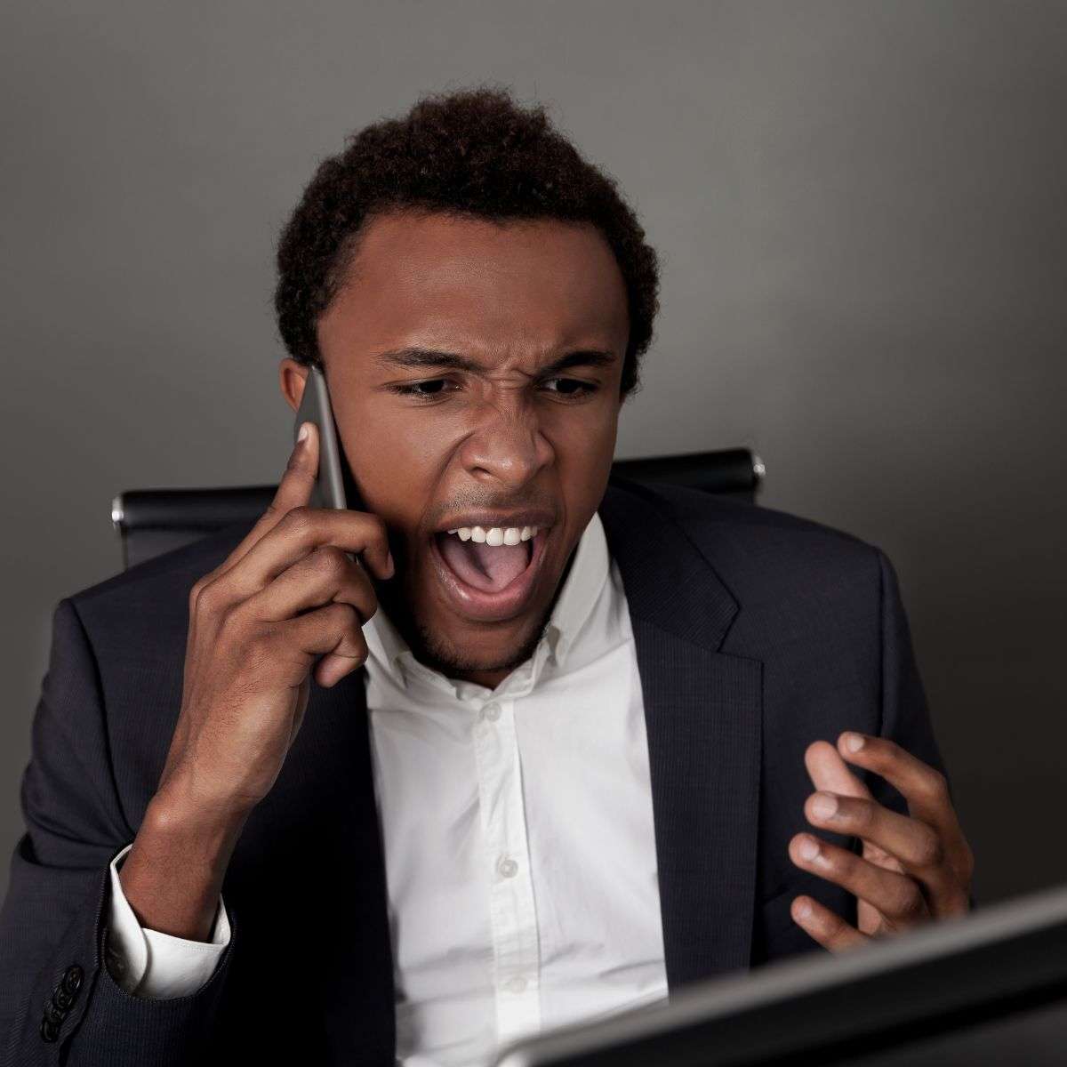 Mindful Healing Anger Management Treatment in New Jersey angry african american or moroccan man on the phone yelling at his computer screen