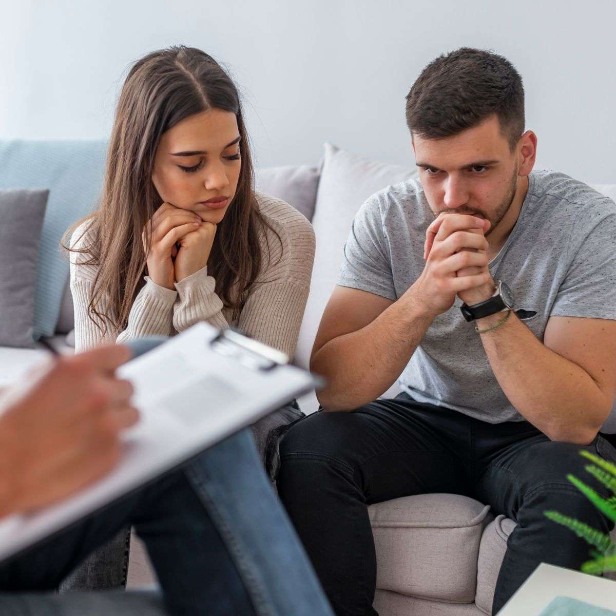 Mindful Healing Couples Therapy and Marriage Counseling in New Jersey couple in front of a therapist with her looking sad and him looking upset