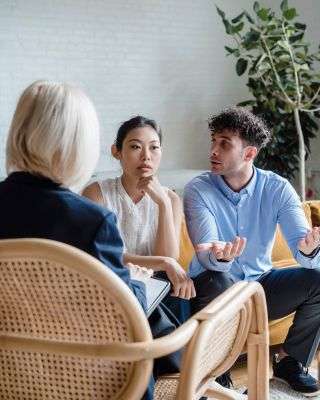 Mindful Healing Couples Therapy in New Jersey couple talking with a therapist trying to improve their relationship
