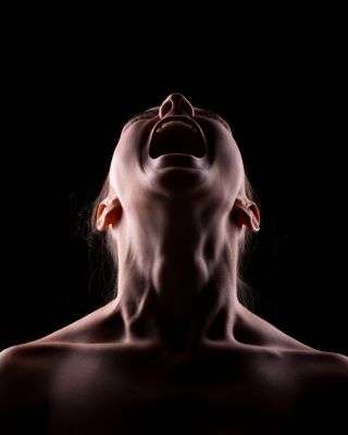 man screaming while looking up to the sky