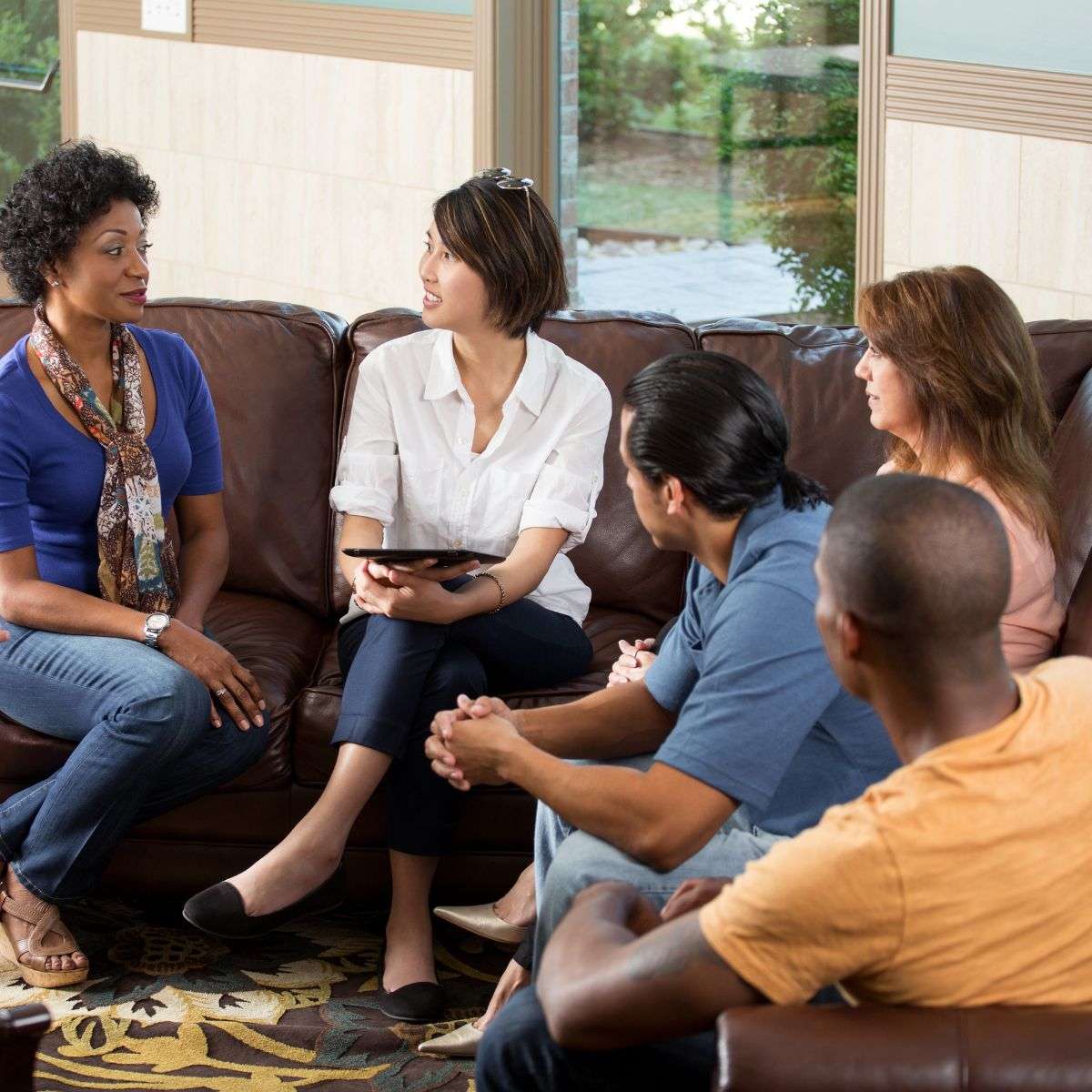 Mindful Healing Group Therapy Sessions in New Jersey diverse group of people sitting on a couch talking