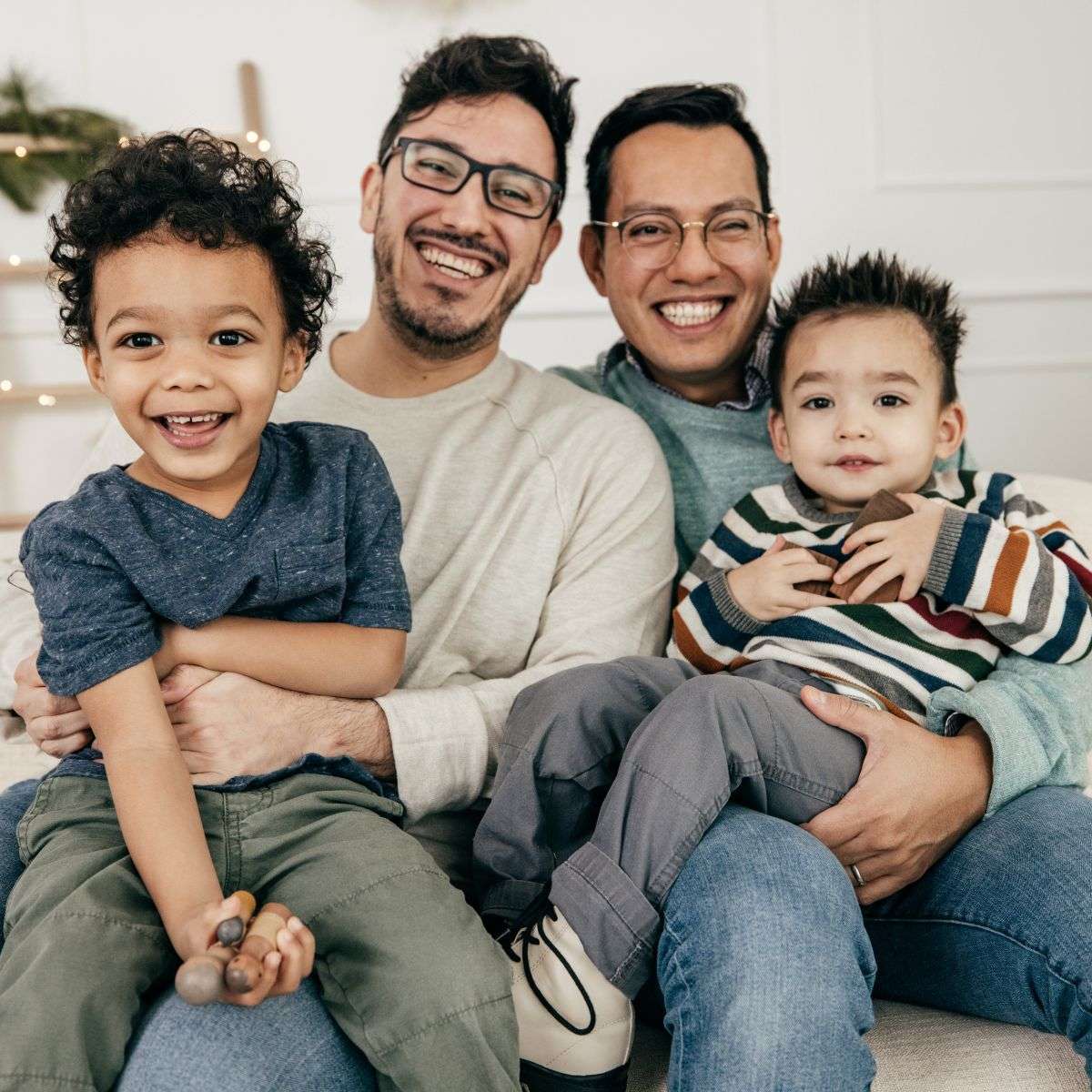 Mindful Healing LGBTQ Therapy in New Jersey two dads smiling holding their two sons