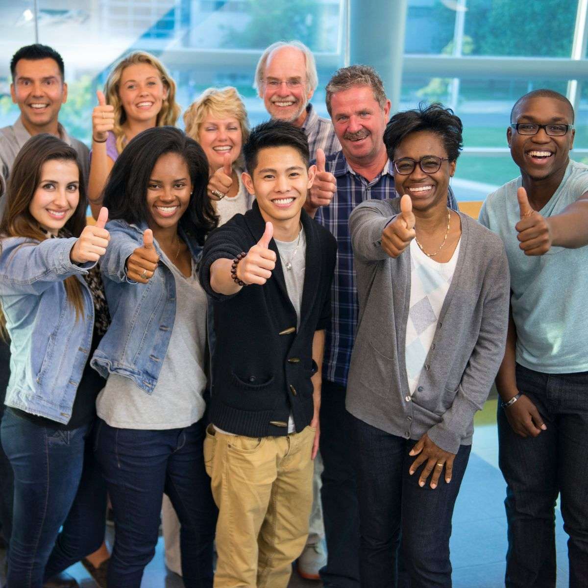 Mindful Healing Life Transitions Counseling in New Jersey diverse group of people all giving a thumbs up embracing who they are