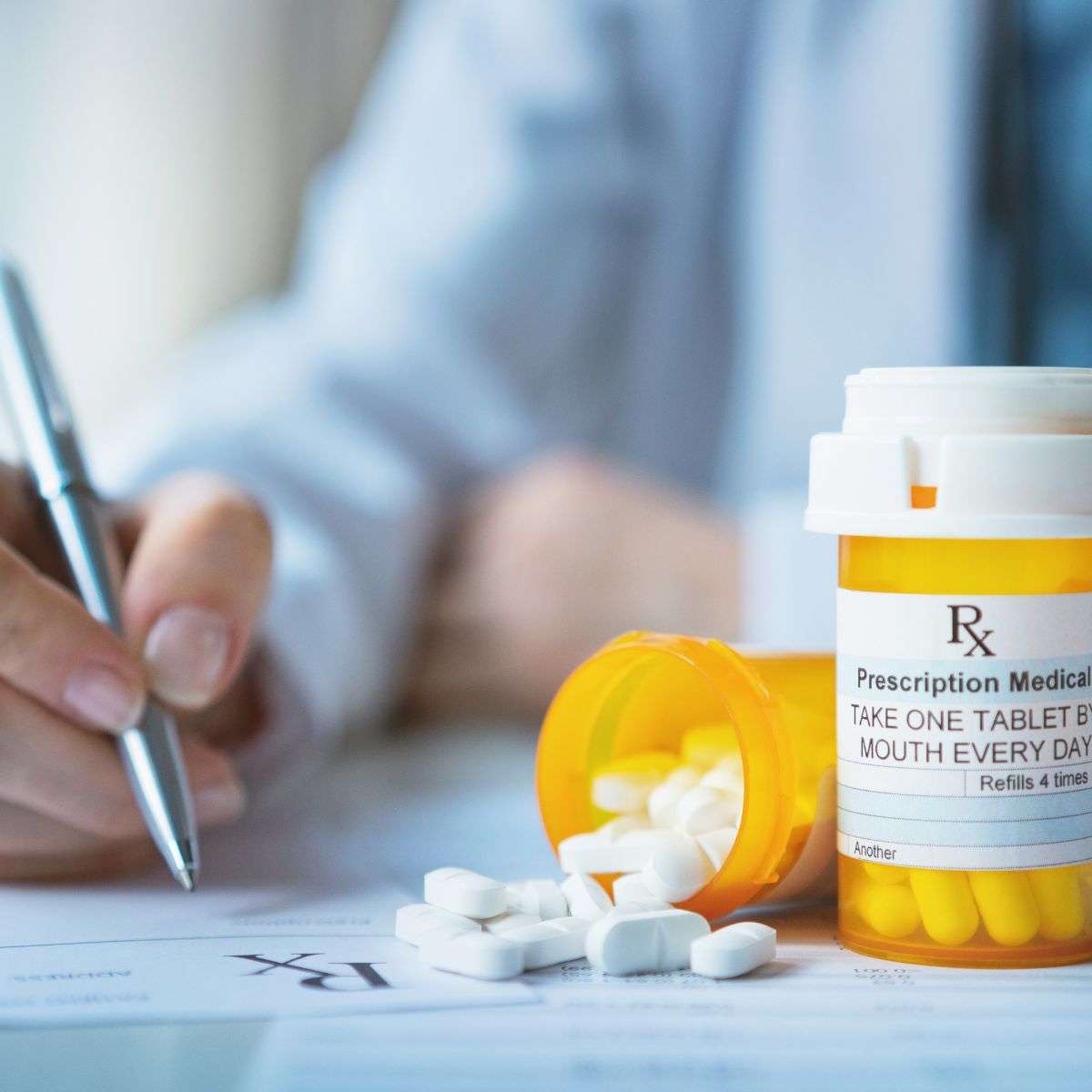 Mindful Healing Medication Management medication bottle and medical professional writing on a clip board in the background