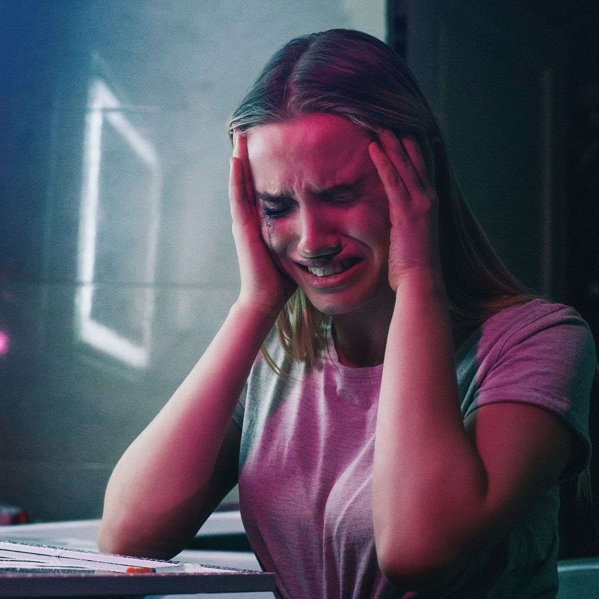 Mindful Healing Substance Use Treatment in New Jersey Young woman crying near a mirror with lines of white powder on it as though she does not want to use that powder