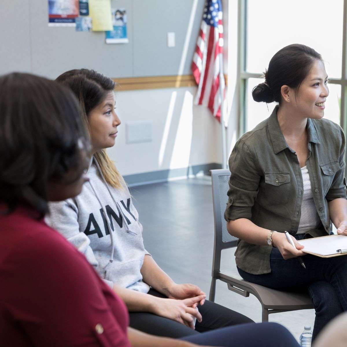 Mindful Healing Veteran Therapy in New Jersey three wome in a group therapy session listening to another's story