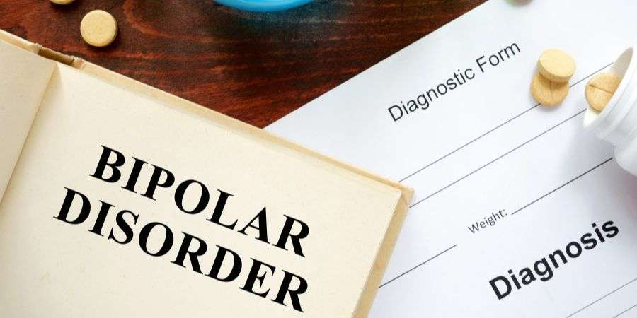 Mindful Healing Bipolar disorder diagnosis paperwork and medication in the background