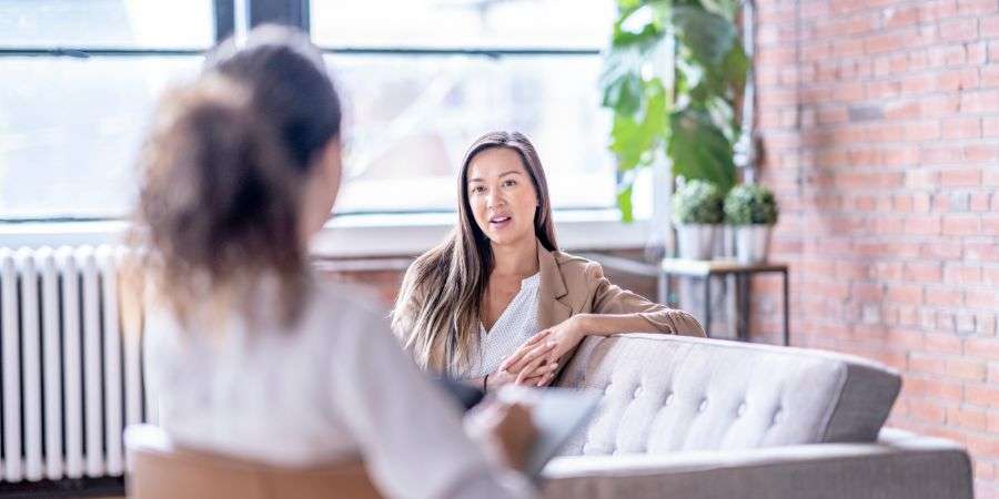 Mindful Healing two women talking during a therapy session